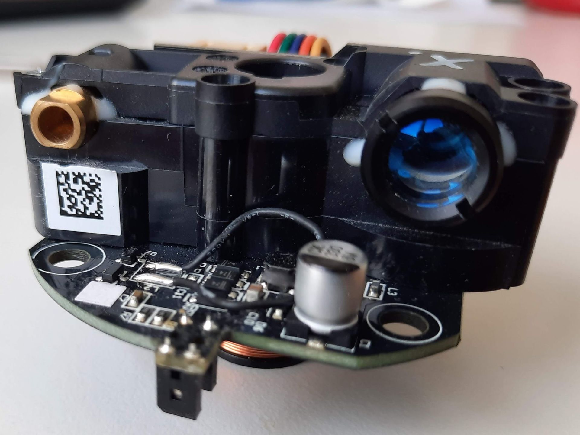Close-up of a small rotating LiDAR sensor module